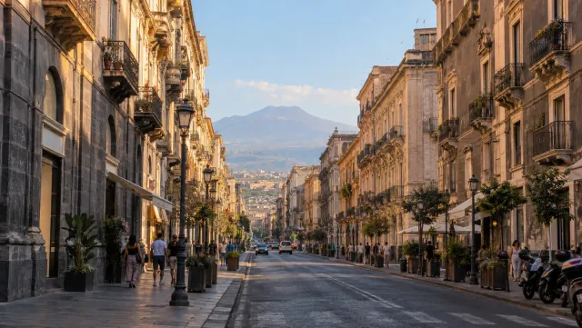 Mount Etna beyond Via Etnea in Catania in late afternoon light