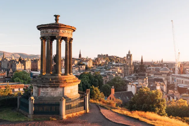 Dugald Stewart Monument on Calton Hill overlooking Edinburgh in warm evening light