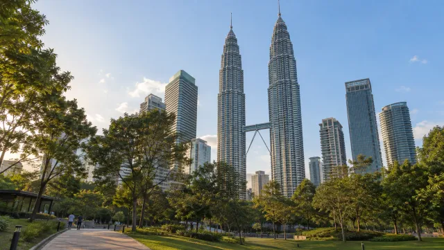Petronas Twin Towers seen from KLCC Park in late-afternoon light
