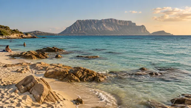 Tavolara island across the clear water from Pittulongu beach near Olbia